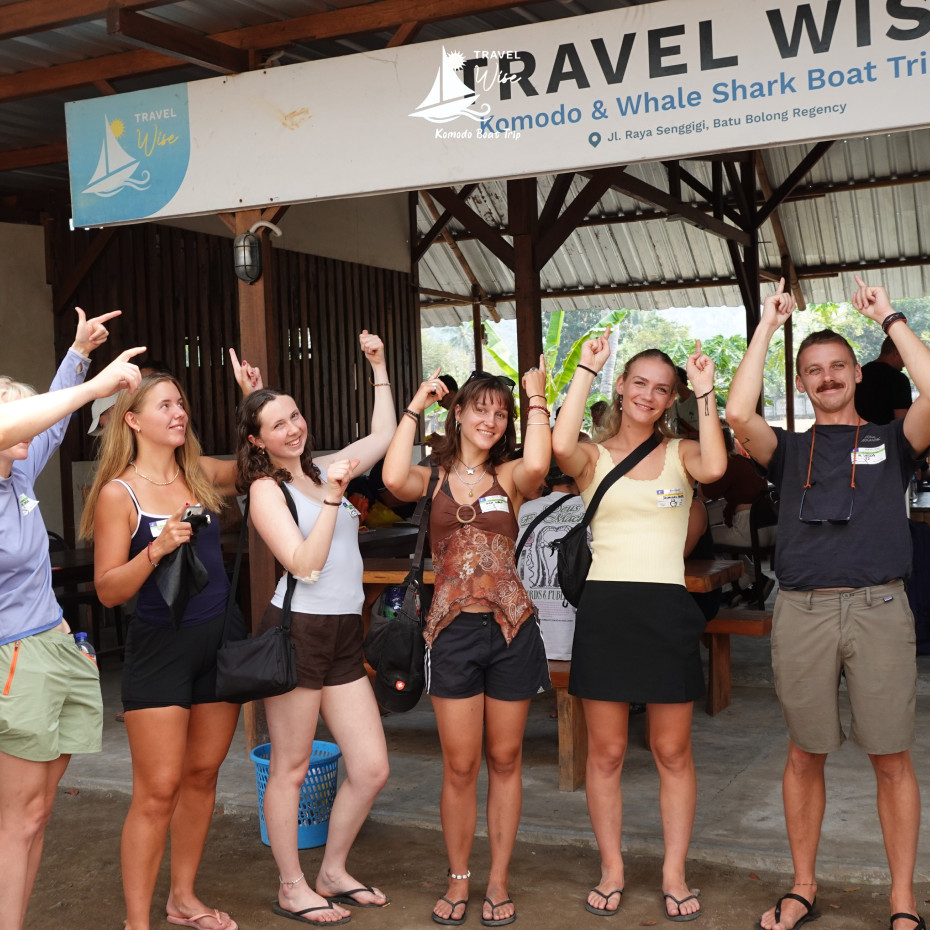 Travelers with luggage waiting at the Senggigi meeting point