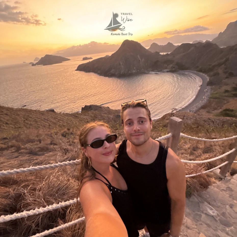 Travelers standing on Padar’s viewpoint at dawn